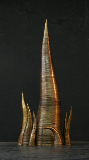 Tusk (14) 13” x 49” (seven smaller versions) brass, epoxy